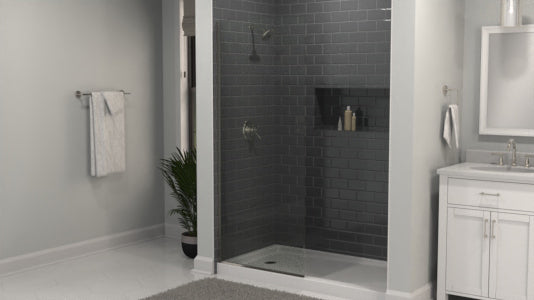 Bathroom with shower screen enclosure, sink, and towel rack.