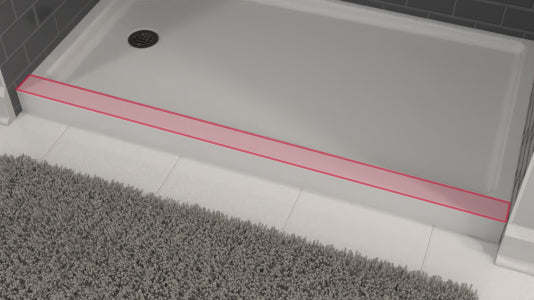 Shower tray with a red line indicating the sill location on a tiled floor.