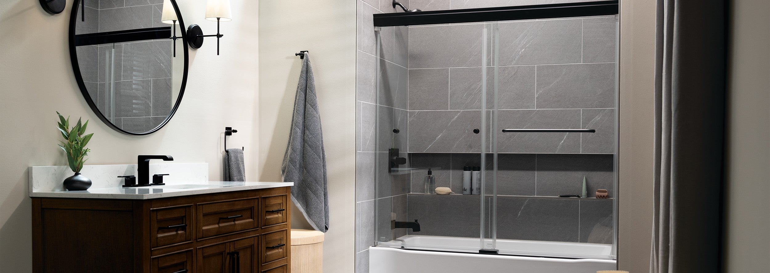 Bathroom interior with a bathtub, sink, and mirror.