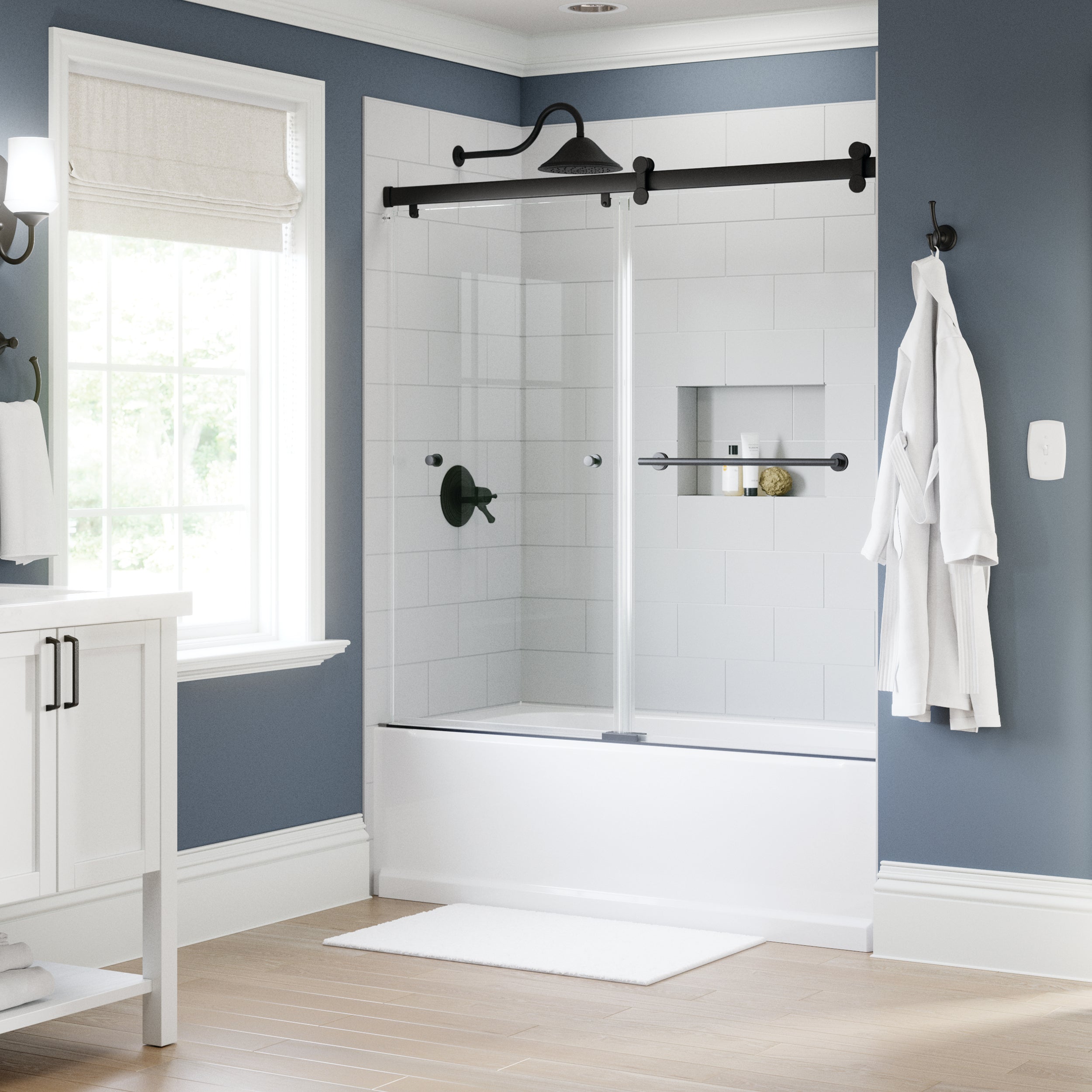 Modern white bathroom with black hardware on Sliding Bathtub Door