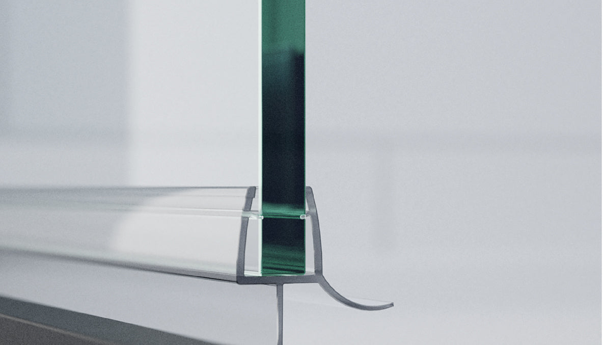 close up of shower door glass showing green  glass tint